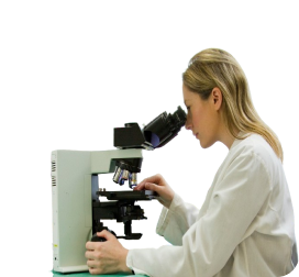 woman looking into microscope